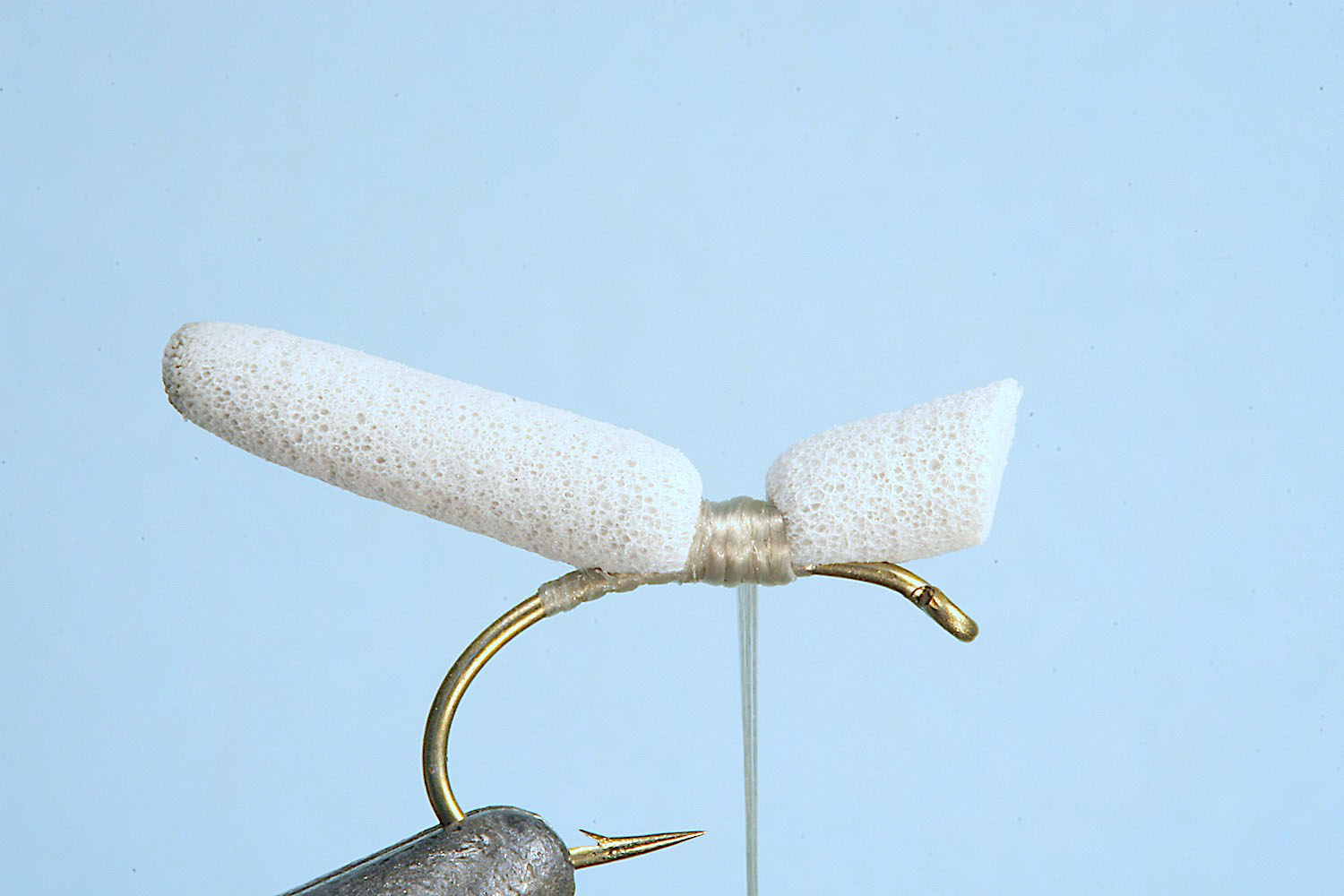 Showing step 3 of tying sequence for hot foam hopper fly pattern
