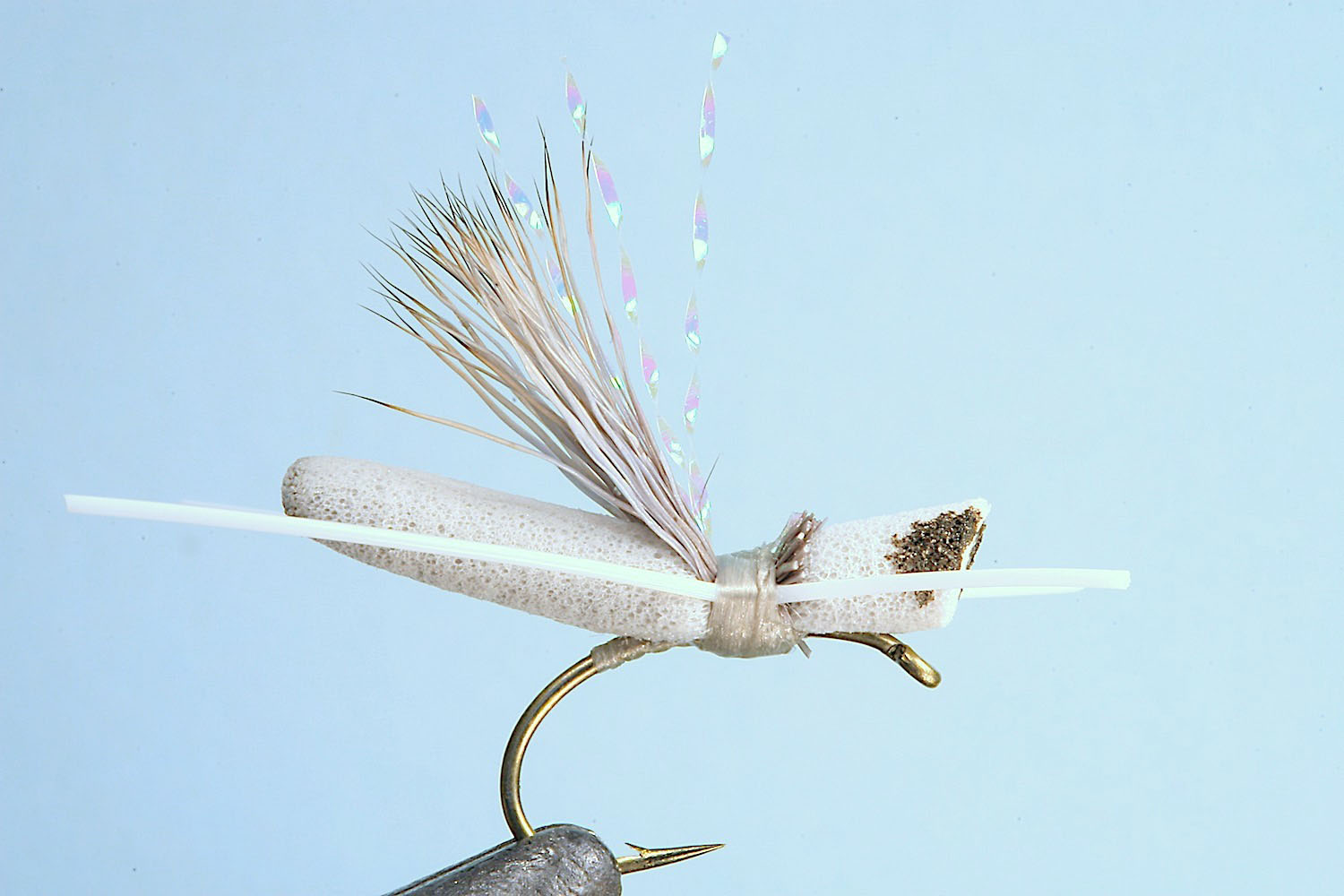 Showing step 6 of tying sequence for hot foam hopper fly pattern