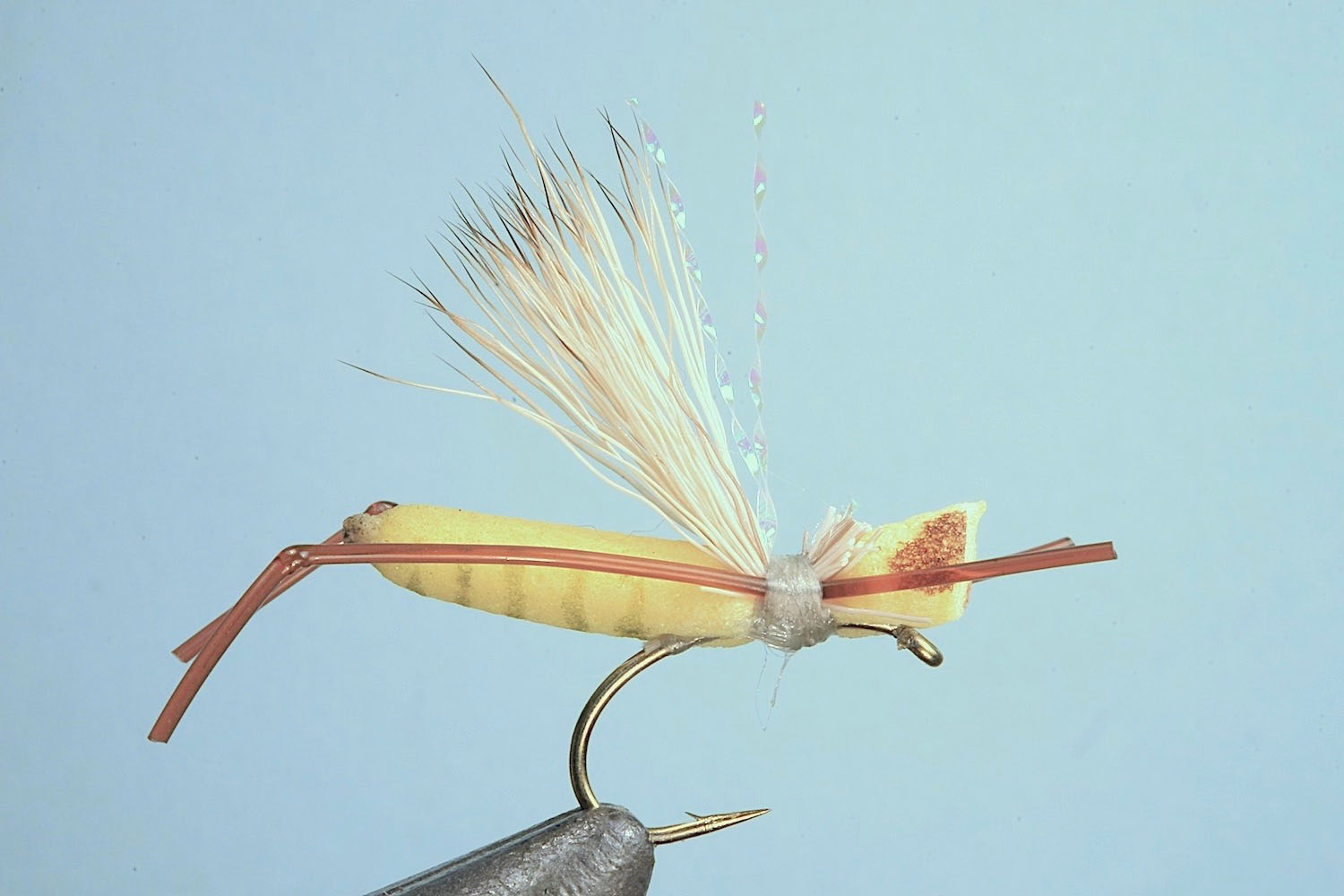 Showing step 7 of tying sequence for hot foam hopper fly pattern