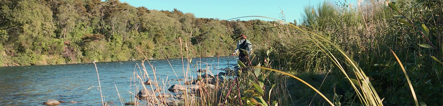 fly fisherman on river