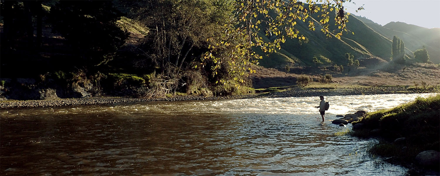 fisherman fly fishing on Ruakituri River single hand spey casting